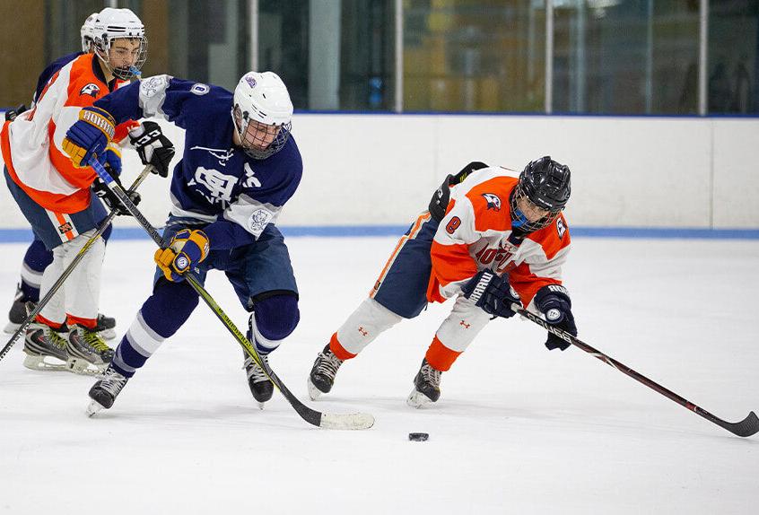 Poly Prep students playing hockey